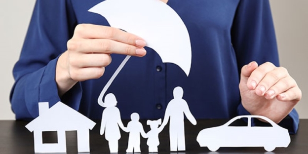 A person holding a paper cutout of a family and car AI-generated content may be incorrect.