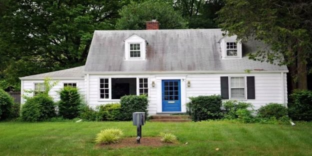 A house with a blue door AI-generated content may be incorrect.