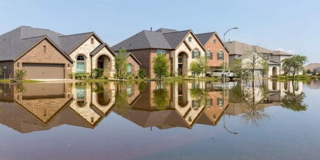 A row of houses reflected in water AI-generated content may be incorrect.